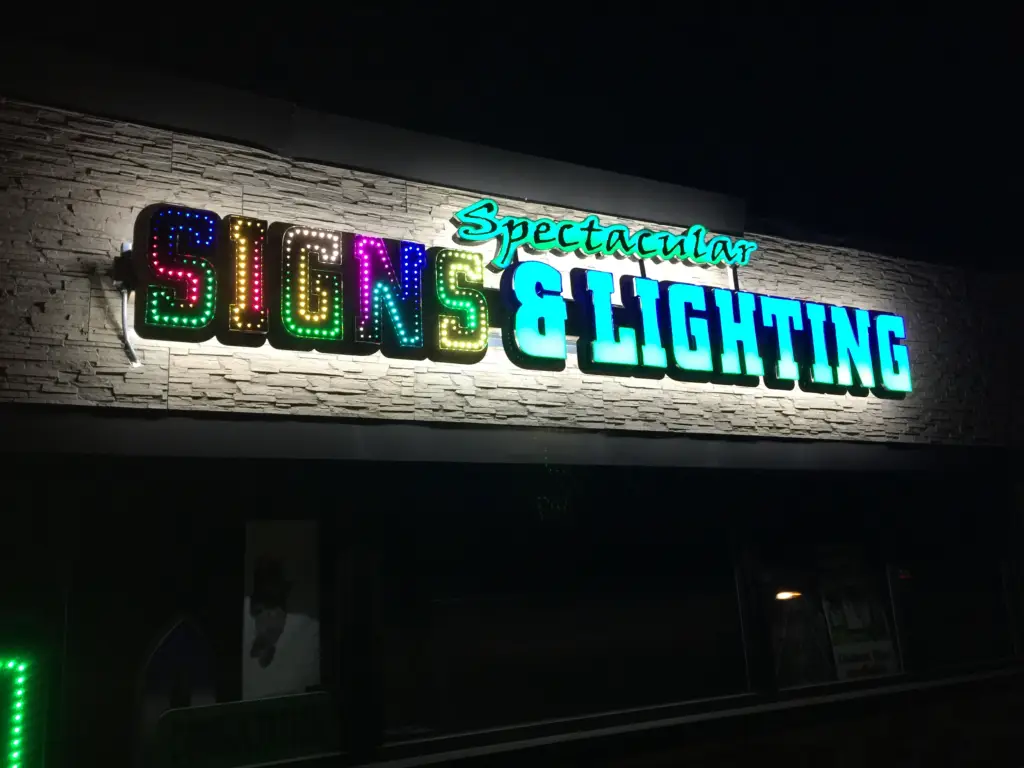 spectacular-signs-bldg-at-night.webp